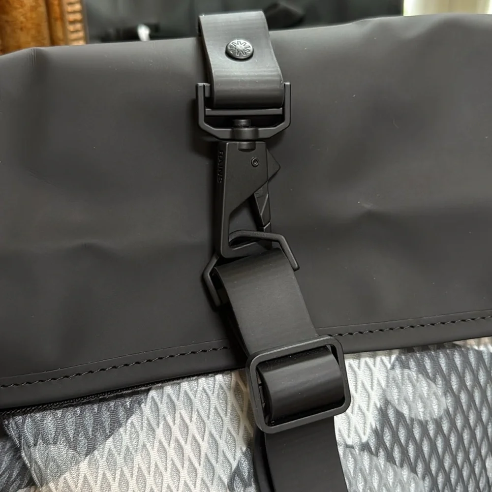 New Rains Black and Gray Unisex camo look Backpack.